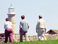 Day-trippers walking towards the Old Light