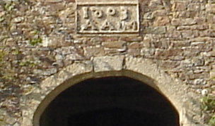 Plaque above door of Tetcott House